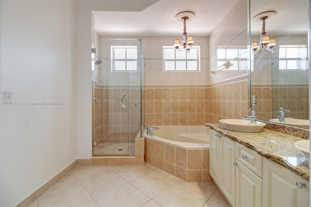9072 NW 145th St, Miami Lakes, FL 33018 - full bathroom featuring a chandelier, a garden tub, healthy amount of natural light, and a stall shower
