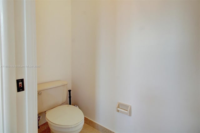 9072 NW 145th St, Miami Lakes, FL 33018 - bathroom featuring toilet and baseboards