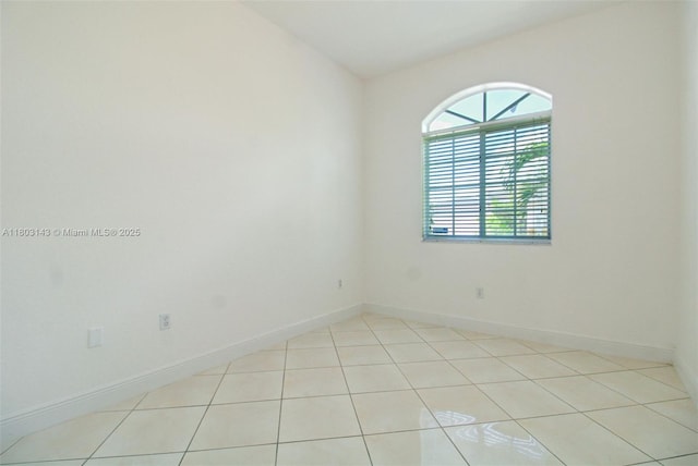 9072 NW 145th St, Miami Lakes, FL 33018 - empty room with baseboards and light tile patterned flooring