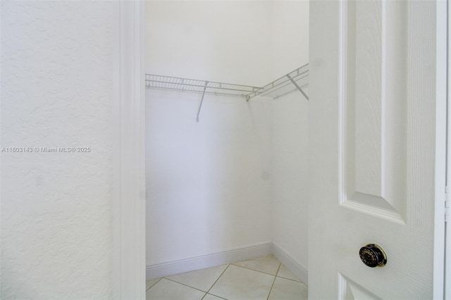 9072 NW 145th St, Miami Lakes, FL 33018 - spacious closet featuring light tile patterned flooring