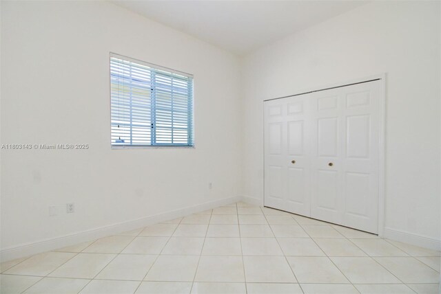 9072 NW 145th St, Miami Lakes, FL 33018 - unfurnished bedroom featuring baseboards and a closet