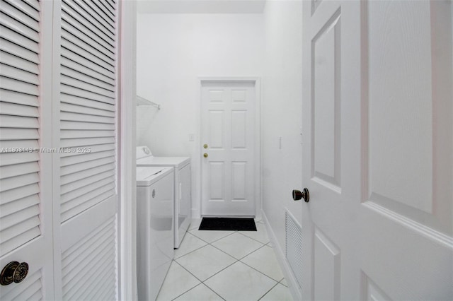 9072 NW 145th St, Miami Lakes, FL 33018 - laundry room featuring washer and clothes dryer and light tile patterned flooring
