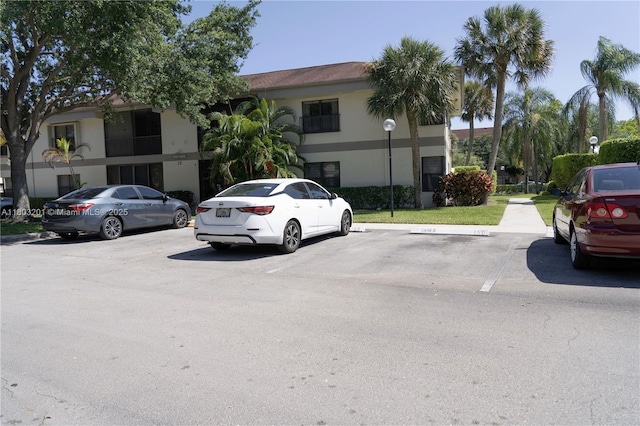2903 S Carambola Cir S Unit 2094, Coconut Creek, FL 33066 - view of front of home featuring uncovered parking and stucco siding