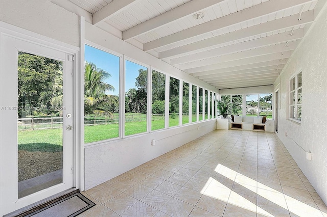 5200 SW 199th Ave, Southwest Ranches, FL 33332 - unfurnished sunroom with beam ceiling, plenty of natural light, a textured wall, tile patterned floors, and an outdoor hangout area