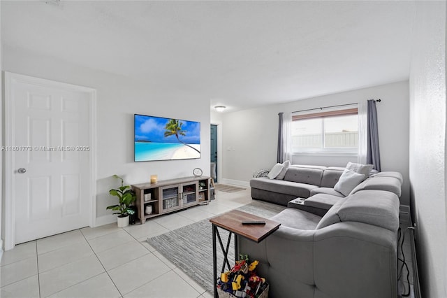 857 W 37th St, Hialeah, FL 33012 - living room with light tile patterned floors and baseboards