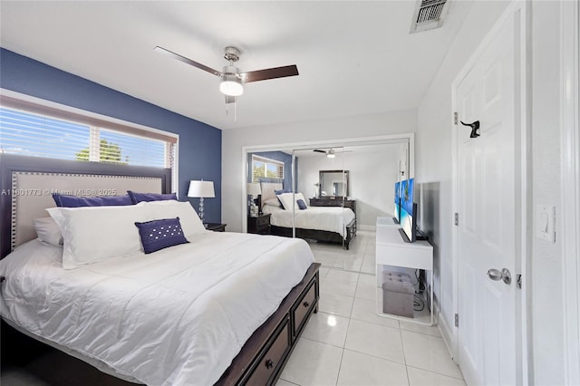 857 W 37th St, Hialeah, FL 33012 - bedroom featuring light tile patterned floors, ceiling fan, a closet, and baseboards