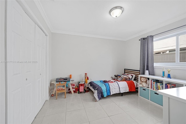 857 W 37th St, Hialeah, FL 33012 - bedroom with ornamental molding, a closet, and light tile patterned flooring