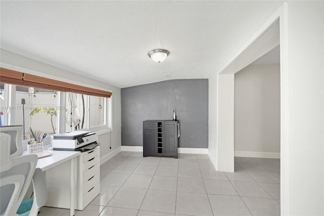 857 W 37th St, Hialeah, FL 33012 - kitchen featuring light tile patterned floors, baseboards, and a textured ceiling