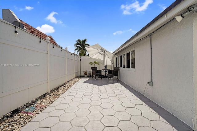 857 W 37th St, Hialeah, FL 33012 - fenced backyard with a patio
