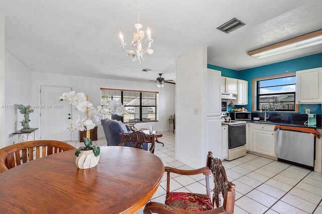 17331 SW 119th Ave, Miami, FL 33177 - dining space featuring a chandelier, light tile patterned floors, and ceiling fan