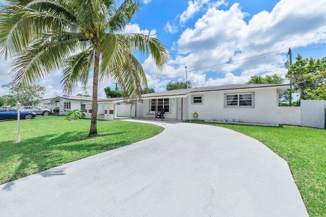 17331 SW 119th Ave, Miami, FL 33177 - ranch-style house featuring driveway, a front yard, and brick siding
