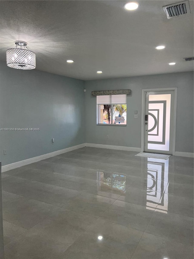 6014 SW 162nd Pl, Miami, FL 33193 - tiled empty room featuring recessed lighting