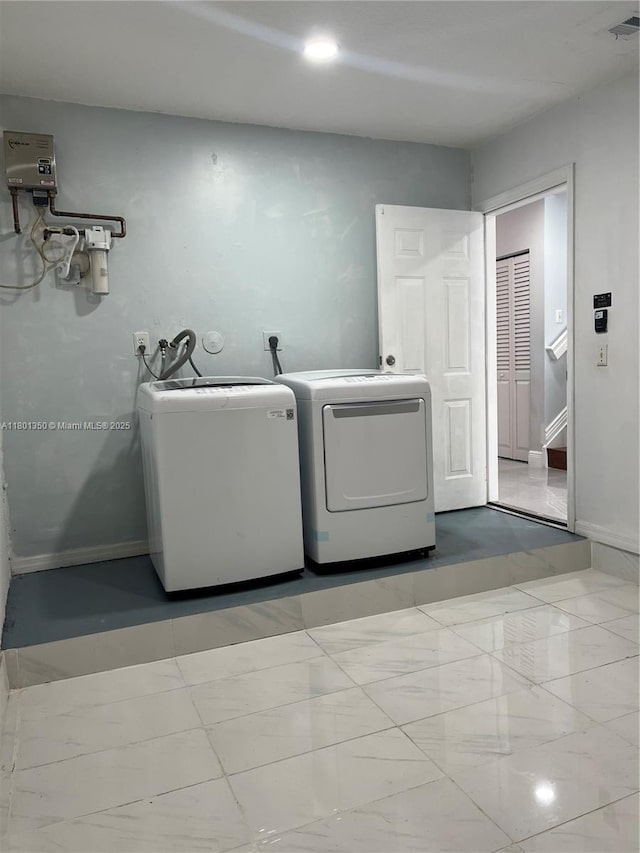 6014 SW 162nd Pl, Miami, FL 33193 - washroom with washer and clothes dryer and marble look tile flooring