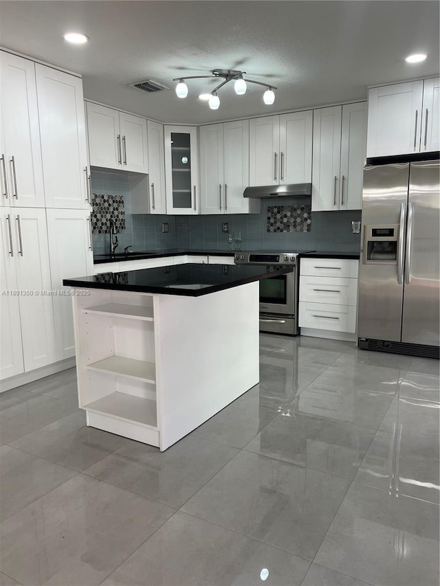 6014 SW 162nd Pl, Miami, FL 33193 - kitchen with appliances with stainless steel finishes, open shelves, white cabinets, and backsplash
