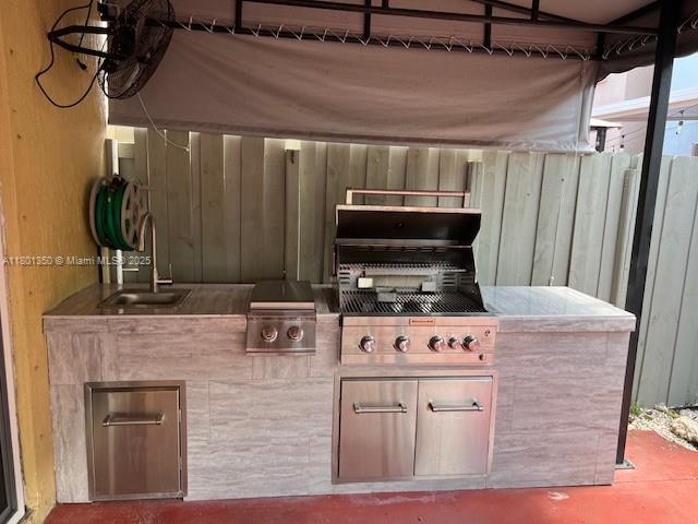 6014 SW 162nd Pl, Miami, FL 33193 - view of patio / terrace featuring a sink and an outdoor kitchen