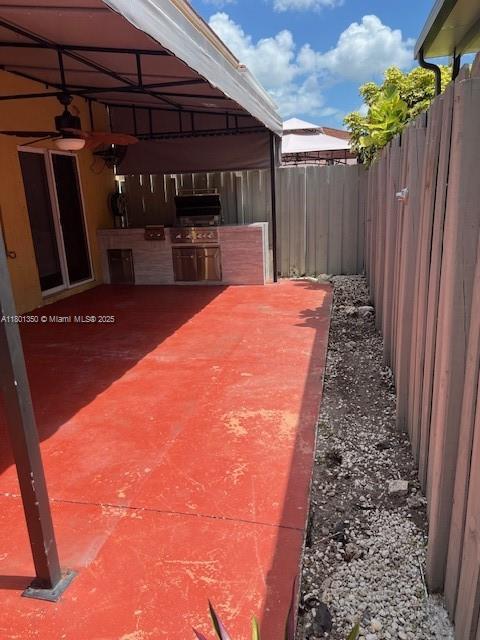 6014 SW 162nd Pl, Miami, FL 33193 - view of patio with an outdoor kitchen