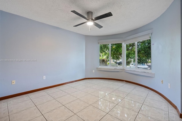 3161 SW 138th Ave, Miami, FL 33175 - spare room with a textured ceiling, a ceiling fan, baseboards, and light tile patterned floors