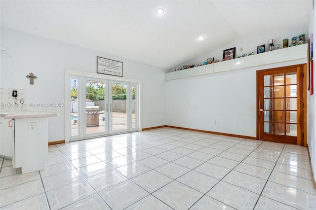3161 SW 138th Ave, Miami, FL 33175 - unfurnished living room with french doors, lofted ceiling, light tile patterned flooring, recessed lighting, and baseboards