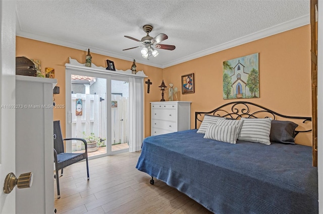 13338 SW 8th Ln, Miami, FL 33184 - bedroom featuring access to outside, wood finished floors, crown molding, a textured ceiling, and ceiling fan