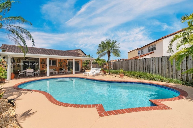 13338 SW 8th Ln, Miami, FL 33184 - view of swimming pool featuring a patio and a fenced backyard