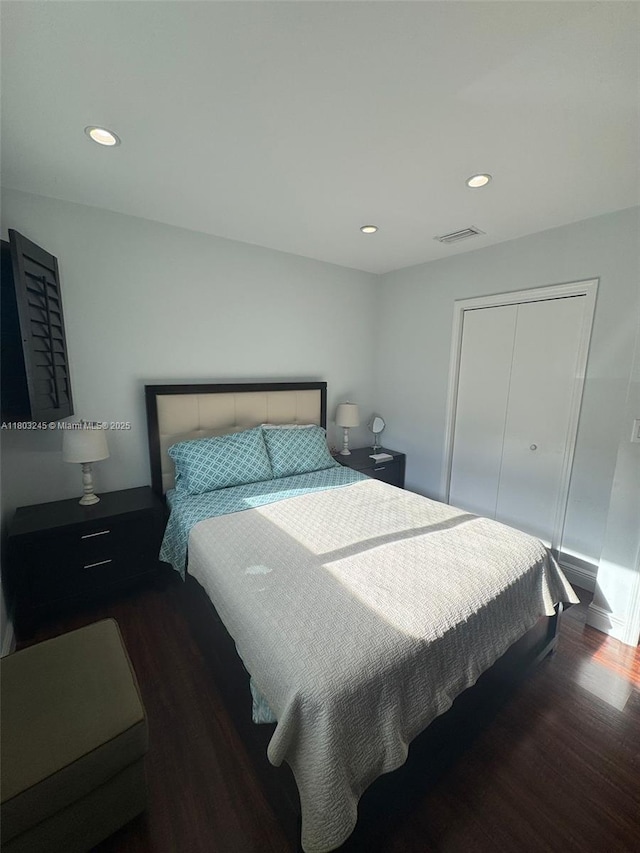 111 SW 24th Ave, Miami, FL 33135 - bedroom with wood finished floors, recessed lighting, and a closet