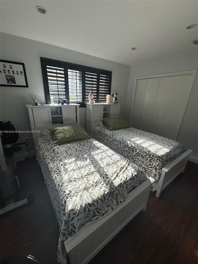 111 SW 24th Ave, Miami, FL 33135 - bedroom with wood finished floors, a closet, recessed lighting, and baseboards