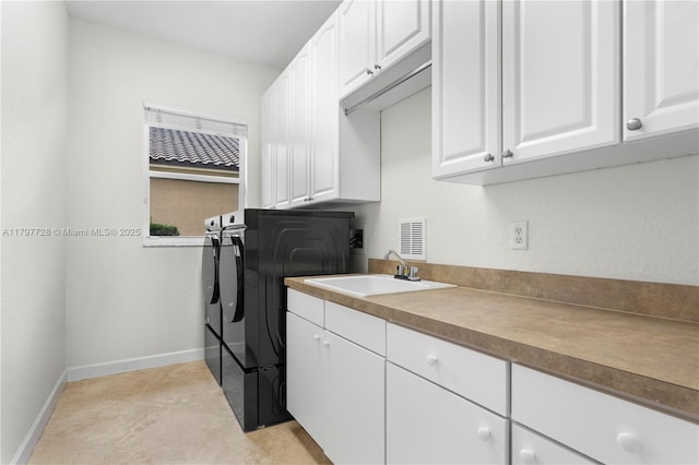 3837 E Coquina Way, Weston, FL 33332 - laundry room featuring cabinet space, washer and dryer, and baseboards