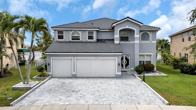 15331 SW 20th St, Miramar, FL 33027 - view of front of property with an attached garage, stucco siding, decorative driveway, and a tile roof