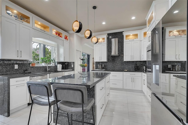 15331 SW 20th St, Miramar, FL 33027 - kitchen with wall chimney exhaust hood, backsplash, crown molding, a kitchen island, and white cabinets