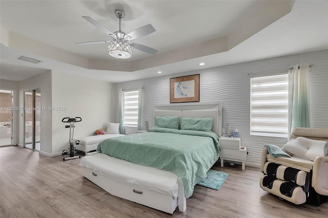 15331 SW 20th St, Miramar, FL 33027 - bedroom with wood finished floors, a tray ceiling, baseboards, recessed lighting, and ceiling fan