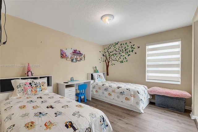 15331 SW 20th St, Miramar, FL 33027 - bedroom with wood finished floors and a textured ceiling
