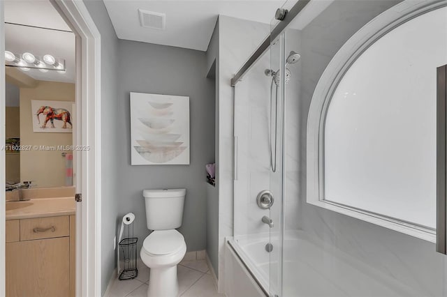 15331 SW 20th St, Miramar, FL 33027 - full bath featuring tile patterned floors, toilet, vanity, bath / shower combo with glass door, and baseboards