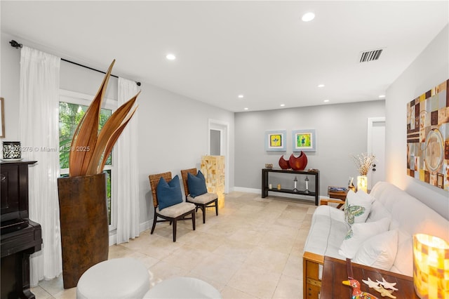 6809 Mentone St, Coral Gables, FL 33146 - living area featuring recessed lighting, light tile patterned flooring, and baseboards