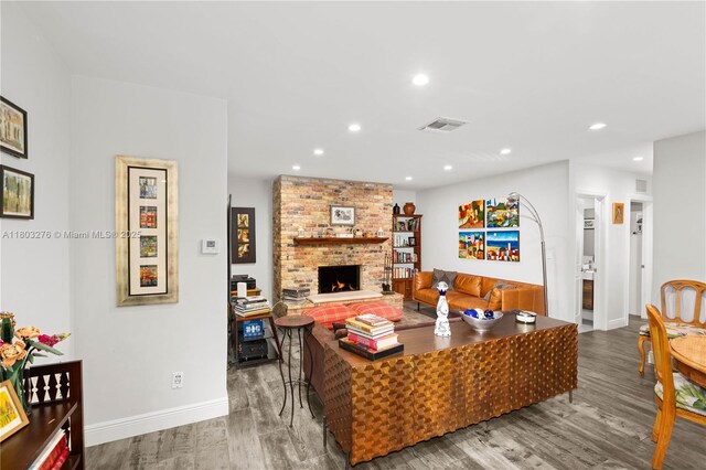 6809 Mentone St, Coral Gables, FL 33146 - living room featuring wood finished floors, recessed lighting, baseboards, and a fireplace