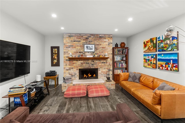 6809 Mentone St, Coral Gables, FL 33146 - living room with wood finished floors, recessed lighting, and a brick fireplace