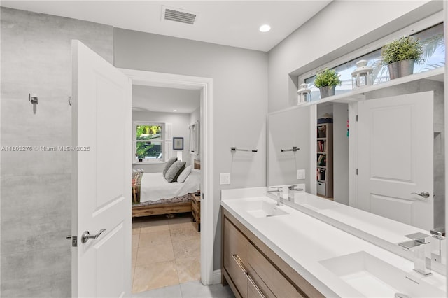 6809 Mentone St, Coral Gables, FL 33146 - bathroom featuring ensuite bathroom, double vanity, recessed lighting, and tile patterned floors