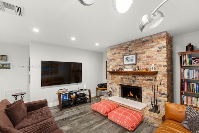 6809 Mentone St, Coral Gables, FL 33146 - living room featuring wood finished floors, recessed lighting, a fireplace, and baseboards