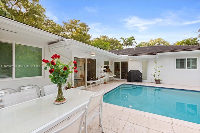 6809 Mentone St, Coral Gables, FL 33146 - outdoor pool with grilling area, a patio area, and outdoor dining space