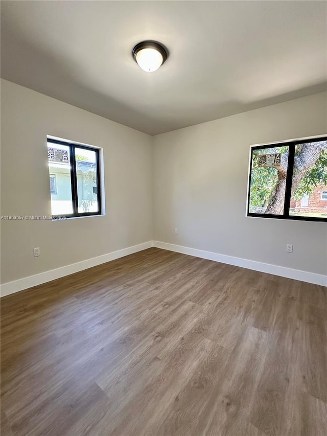 1769 NW 41st St, Miami, FL 33142 - unfurnished room featuring dark wood finished floors and baseboards