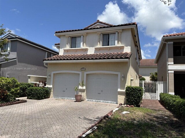14737 SW 132nd Ct, Miami, FL 33186 - mediterranean / spanish home featuring a tile roof, a garage, and stucco siding