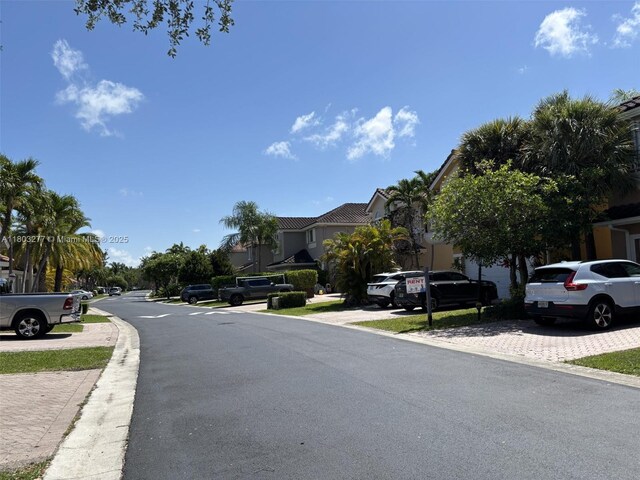 14737 SW 132nd Ct, Miami, FL 33186 - view of asphalt street featuring a residential view and curbs