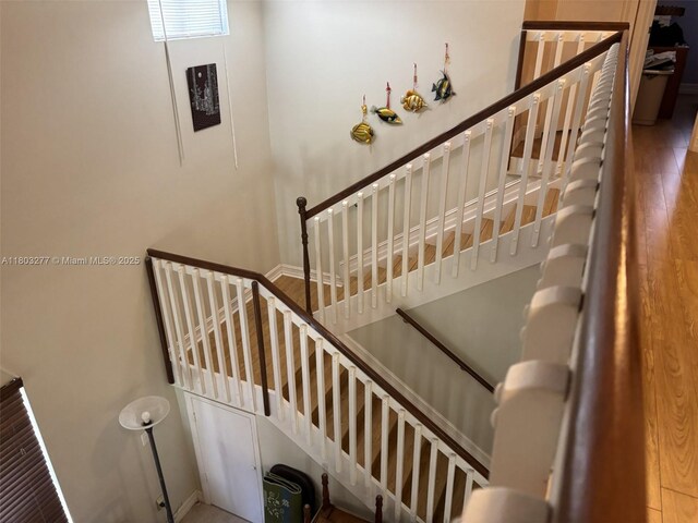 14737 SW 132nd Ct, Miami, FL 33186 - staircase with wood finished floors and baseboards