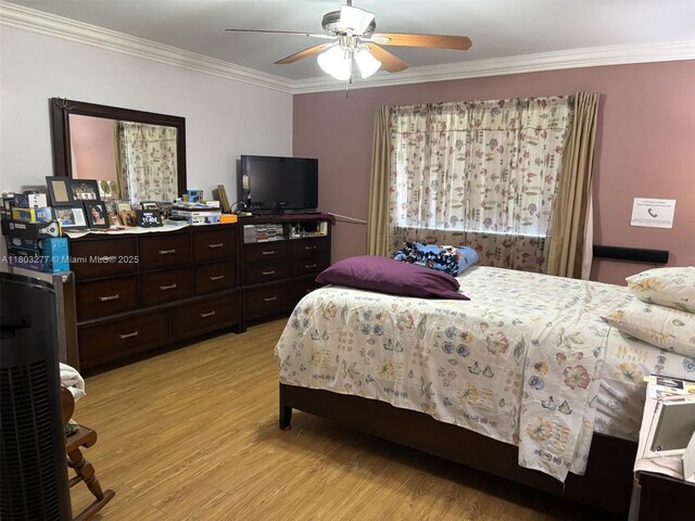 14737 SW 132nd Ct, Miami, FL 33186 - bedroom featuring ornamental molding, light wood-type flooring, and ceiling fan