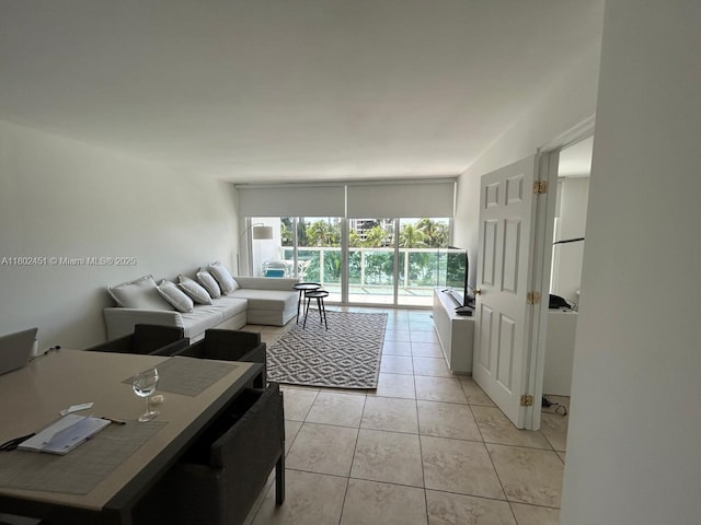 100 Bayview Dr Unit 309, Sunny Isles Beach, FL 33160 - living area featuring light tile patterned flooring and a desk