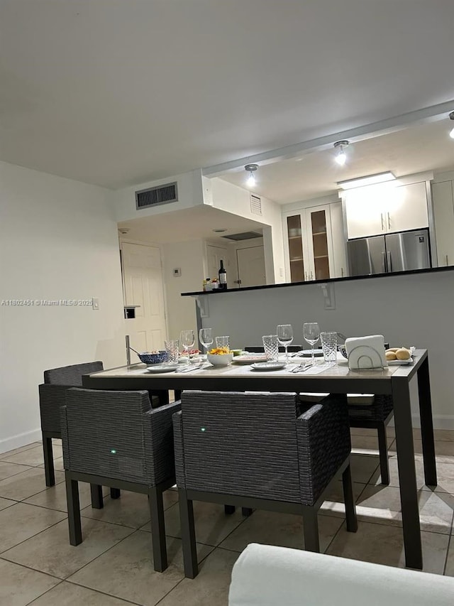 100 Bayview Dr Unit 309, Sunny Isles Beach, FL 33160 - dining space featuring baseboards and light tile patterned floors