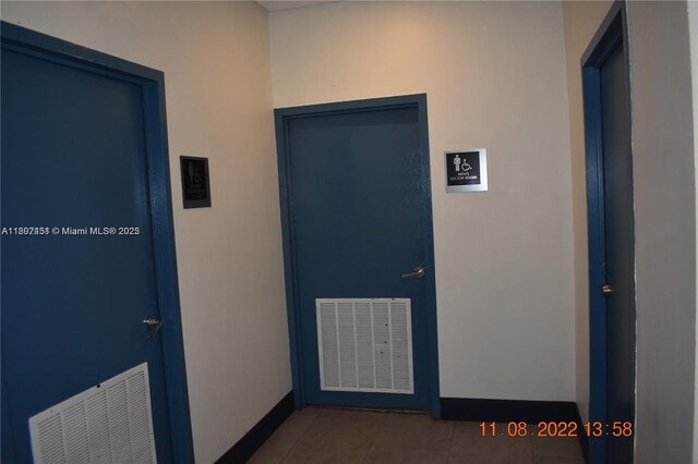100 Bayview Dr Unit 309, Sunny Isles Beach, FL 33160 - corridor featuring baseboards and tile patterned flooring