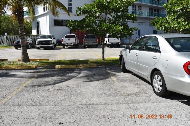 100 Bayview Dr Unit 309, Sunny Isles Beach, FL 33160 - uncovered parking lot with fence