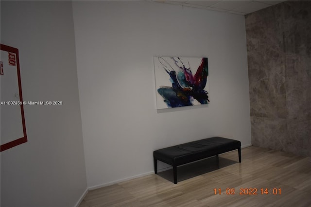 100 Bayview Dr Unit 309, Sunny Isles Beach, FL 33160 - hallway featuring wood finished floors and a paneled ceiling
