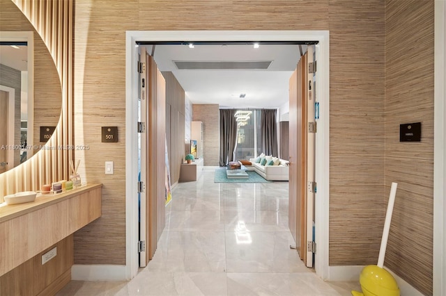 18501 Collins Ave Unit 501, Sunny Isles Beach, FL 33160 - hallway featuring light marble finish floors and baseboards