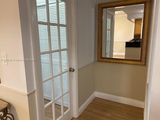 1455 N Treasure Dr Unit 4N, North Bay Village, FL 33141 - doorway with baseboards and wood finished floors
